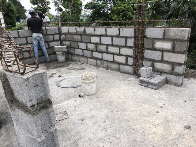 Block walls begin to go up the day after the roof of the first floor was poured.