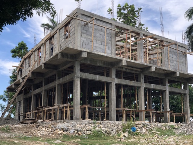 Lower beams were poured above the doors and windows on the second floor.