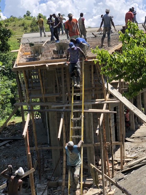 Workers come down the ladder for lunch