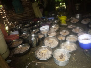 Plates of rice, beans and goat meat await participants in the seed program