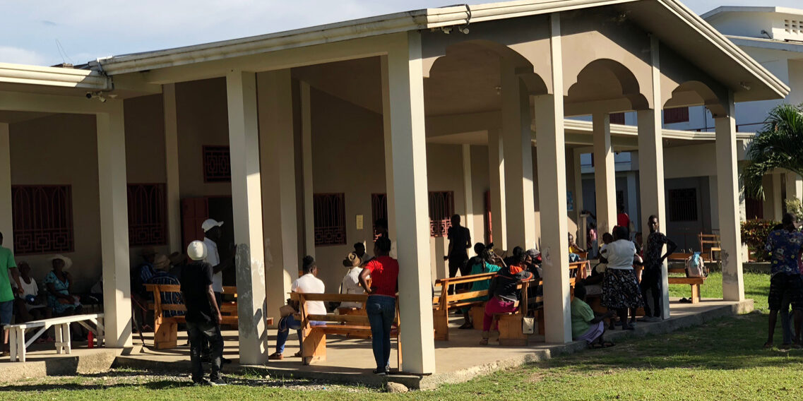 Patients wait on front porch.