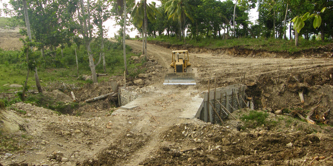 After construction of a bridge over the creek, a road up to the clinic was cleared.