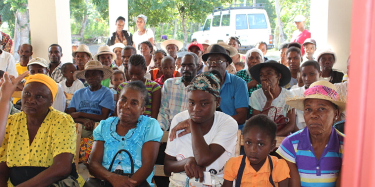 Patients waiting on the front porch of the new clinic building 2015.